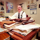 Roth goes over paperwork before "stacking, bundling, and taking out the trash.